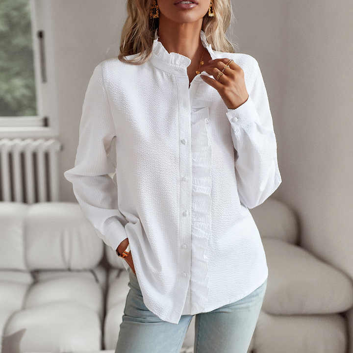 Designet elegant langermet bluse